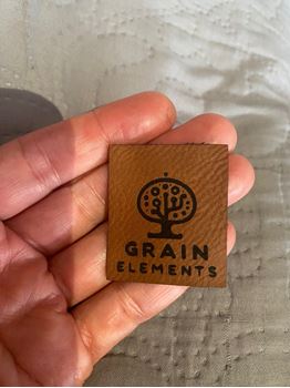 Picture of *OUT OF STOCK* Expected arrival 15/6/2025 -Faux Leather  Tags 30mm x 30mm -100 units. Laser Engraved